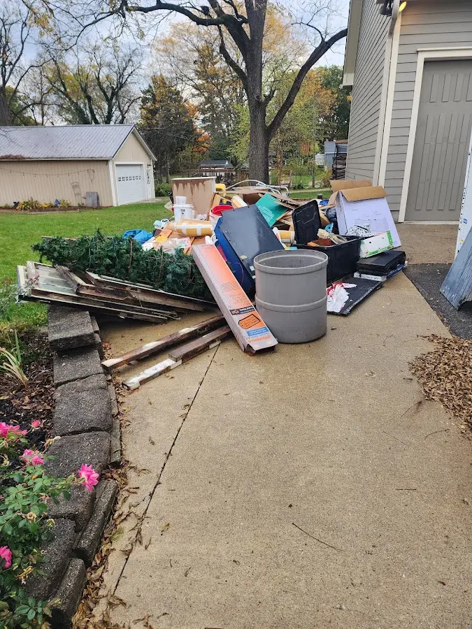 Dumpster being loaded with debris for 12 Yard Dumpster Rental in Northvale
